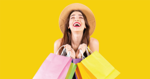Sommer-Schnäppchen-Tage Perg: Eine Frau mit vielen Einkaufstragetaschen freut sich: Sie kauft in Perg gut und günstig ein